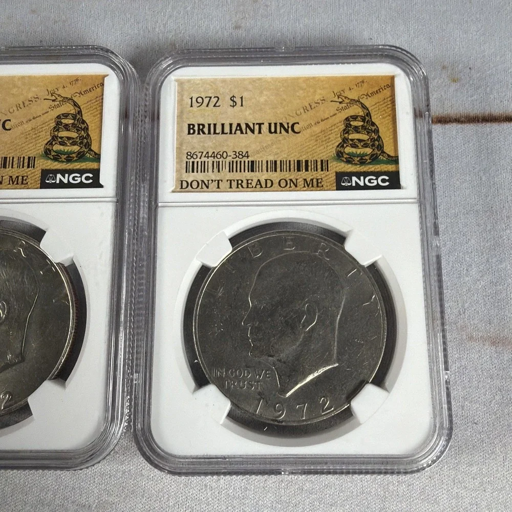 (2) 1972 Eisenhower Dollar Type 1 NGC Brilliant Uncirculated Gadsden Flag Slabs